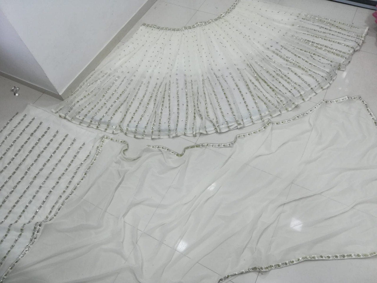 Elegant Off White Georgette Lehenga Choli with Sequined Border Dupatta