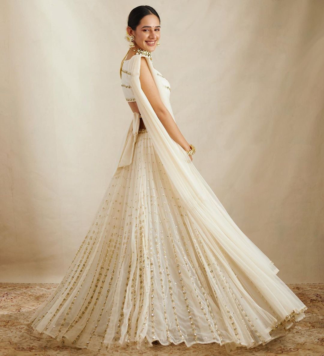 Elegant Off White Georgette Lehenga Choli with Sequined Border Dupatta