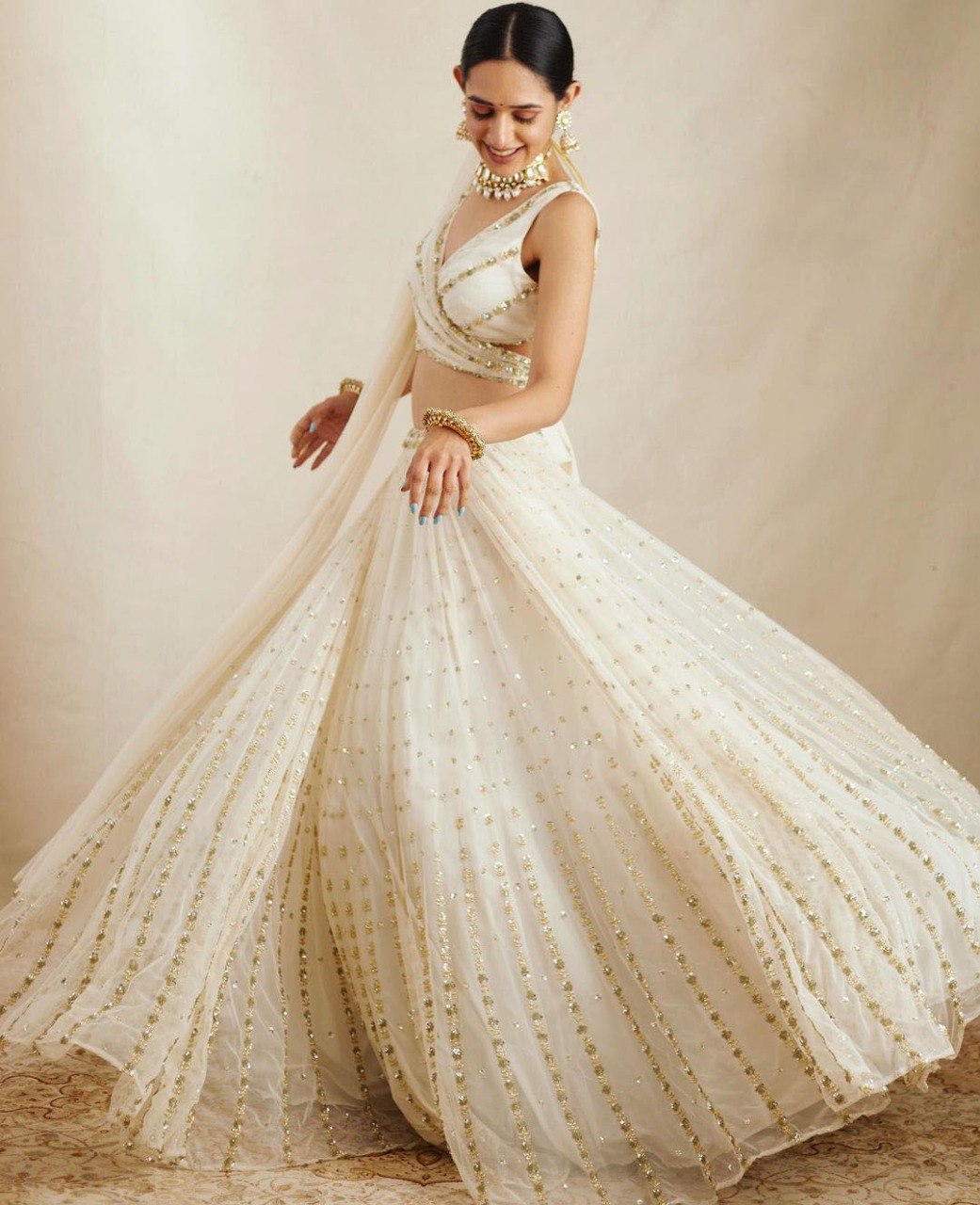 Elegant Off White Georgette Lehenga Choli with Sequined Border Dupatta