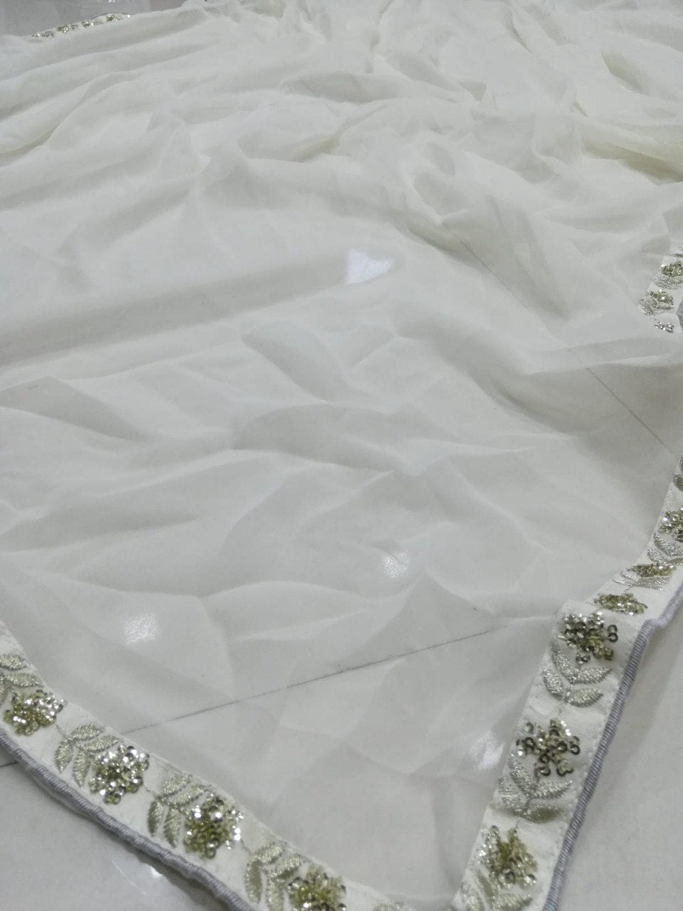 Elegant Off White Georgette Lehenga Choli with Sequined Border Dupatta