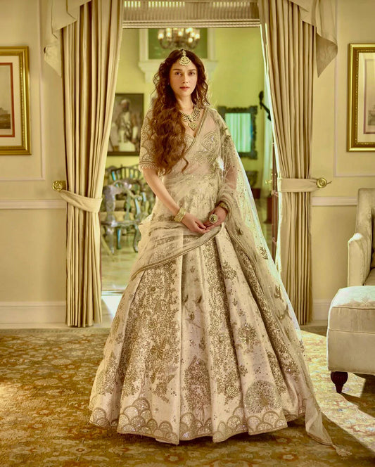 Elegant Ivory Slub Silk Lehenga Choli with Heavy Zari and Sequin Detailing