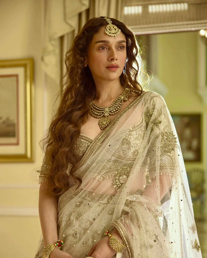 Elegant Ivory Slub Silk Lehenga Choli with Heavy Zari and Sequin Detailing