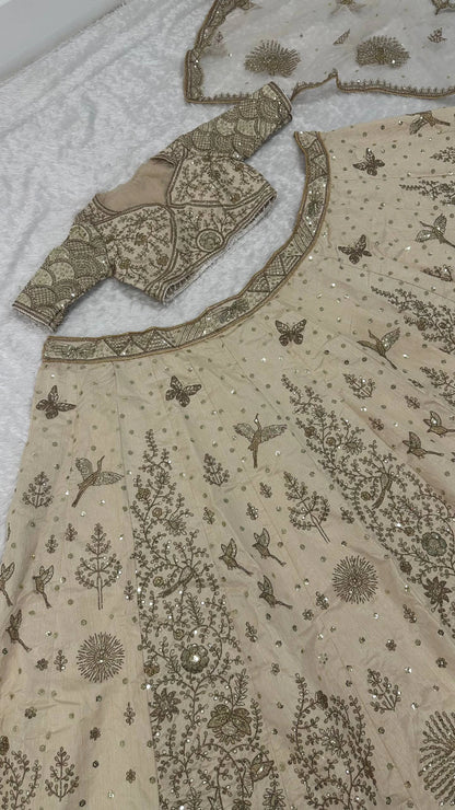 Elegant Ivory Slub Silk Lehenga Choli with Heavy Zari and Sequin Detailing